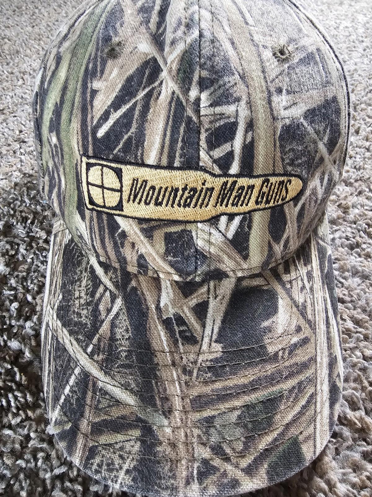 MOUNTAIN MAN GUNS Green Tan Mossy Oak Grass Camo Hat
