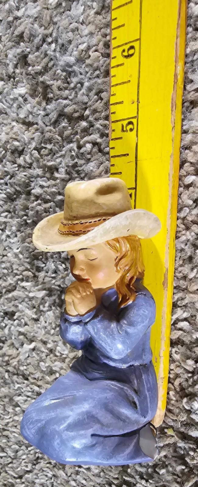 little cowgirl praying figurine Chipped