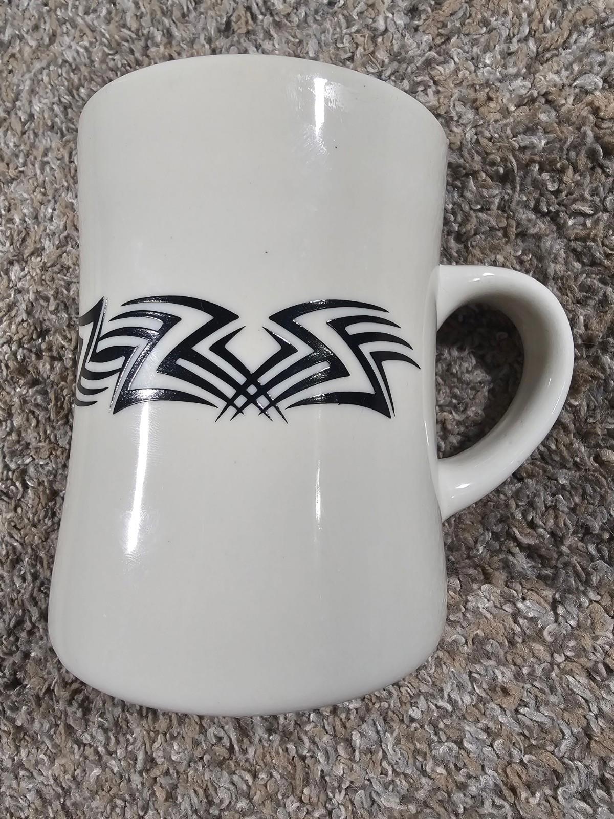 ceramic diner-style coffee mug with a black tribal-style graphic HEAVY