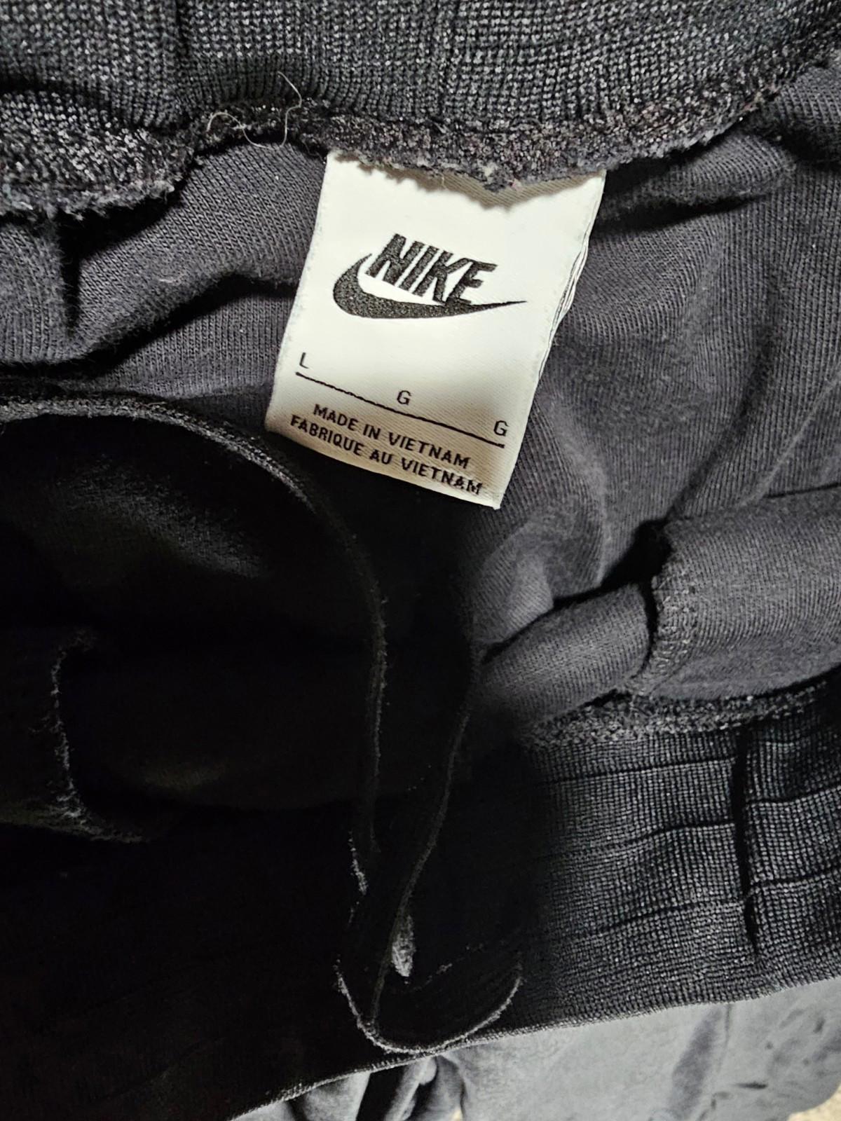 Nike Large athletic pants sewn in creases zippered pockets