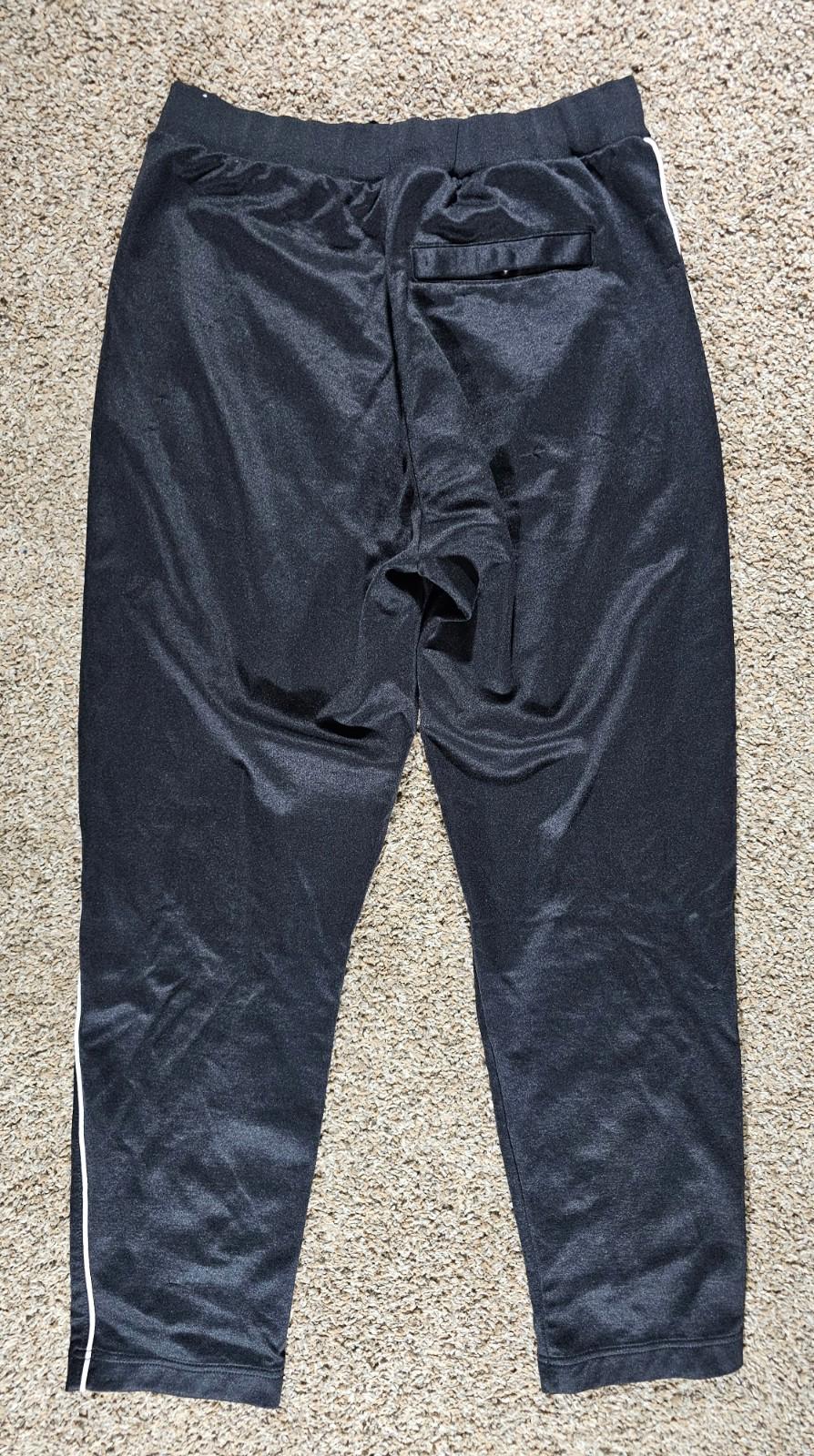 Nike Large athletic pants sewn in creases zippered pockets