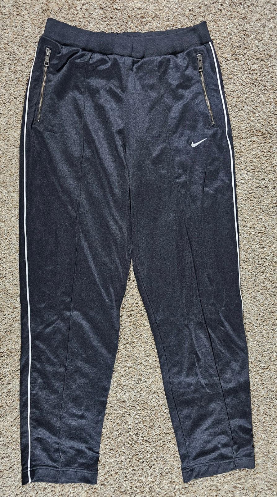 Nike Large athletic pants sewn in creases zippered pockets