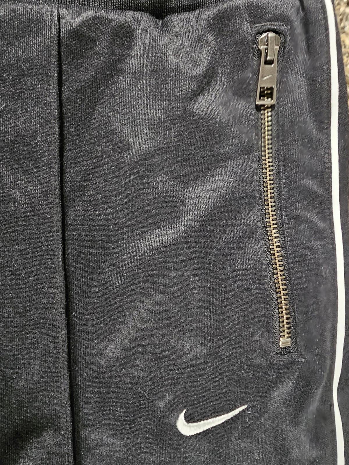Nike Large athletic pants sewn in creases zippered pockets