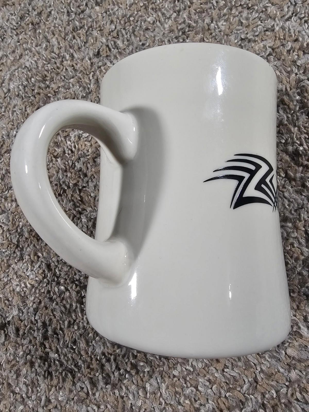 ceramic diner-style coffee mug with a black tribal-style graphic HEAVY